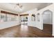 Bright living room featuring hardwood floors, large windows, and an open floor plan at 825 N Sierra Vista Dr, Wickenburg, AZ 85390