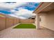 This covered back patio is roomy and features artificial turf and brick pavers at 8957 W Palo Verde Dr, Glendale, AZ 85305