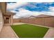 The backyard of this home includes a patio, small grassy area, and gravel at 8957 W Palo Verde Dr, Glendale, AZ 85305