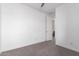 Bedroom with neutral carpet and white doors at 8957 W Palo Verde Dr, Glendale, AZ 85305