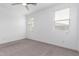 Neutral bedroom featuring large windows with blinds, and neutral carpet at 8957 W Palo Verde Dr, Glendale, AZ 85305