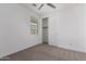 Bedroom featuring neutral carpet, ceiling fan and closet at 8957 W Palo Verde Dr, Glendale, AZ 85305