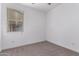 Bedroom with neutral carpet, a ceiling fan, and a window at 8957 W Palo Verde Dr, Glendale, AZ 85305