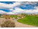 Expansive green space in a Primary-planned community, featuring lush landscaping, walking paths, and a playground at 8957 W Palo Verde Dr, Glendale, AZ 85305