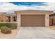 Single-story home showing the two-car garage and front yard at 8957 W Palo Verde Dr, Glendale, AZ 85305