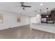 Open-concept living space featuring tile floors and a ceiling fan at 8957 W Palo Verde Dr, Glendale, AZ 85305