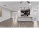 Open-concept living space with a view of the modern kitchen at 8957 W Palo Verde Dr, Glendale, AZ 85305