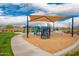 Community playground with climbing structures, shade, and picnic tables at 8957 W Palo Verde Dr, Glendale, AZ 85305