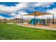 Community playground features climbing structures, shade, and picnic tables at 8957 W Palo Verde Dr, Glendale, AZ 85305