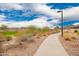 Scenic walking path through a landscaped community, offering residents a peaceful and picturesque route for exercise and relaxation at 8957 W Palo Verde Dr, Glendale, AZ 85305