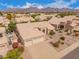 Overhead of the home highlighting the manicured front yard, landscaping, and extended driveway at 9104 E Hillery Dr, Scottsdale, AZ 85260