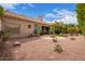 Backyard featuring a fire pit, desert landscaping, and home exterior at 9104 E Hillery Dr, Scottsdale, AZ 85260