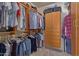 Organized walk-in closet with custom shelving and storage, providing ample space at 9104 E Hillery Dr, Scottsdale, AZ 85260