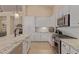 Contemporary kitchen featuring granite countertops, stainless steel appliances and ample cabinet space for easy organization at 9104 E Hillery Dr, Scottsdale, AZ 85260