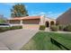 Charming home featuring a red tile roof, well-manicured lawn, and welcoming front entrance with a private garage at 924 W Boxelder Pl, Chandler, AZ 85225