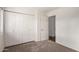 Bedroom featuring double closets and carpeted floors at 945 N Pasadena St # 61, Mesa, AZ 85201