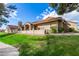 Well-maintained home with stucco, a red tile roof, manicured lawn, and vibrant landscaping at 945 N Pasadena St # 61, Mesa, AZ 85201