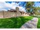 Exterior view of community walking path and green space at 945 N Pasadena St # 61, Mesa, AZ 85201