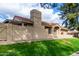 Street view with stucco siding, a red tile roof, manicured lawn and landscaping at 945 N Pasadena St # 61, Mesa, AZ 85201