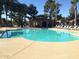 Community pool featuring a covered gazebo and many chairs to relax and enjoy the weather at 945 N Pasadena St # 61, Mesa, AZ 85201