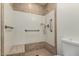 Accessible shower with grab bars and a built-in bench, designed for safety and comfort at 945 N Pasadena St # 61, Mesa, AZ 85201