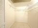 Walk-in closet with wire shelves, white walls, and vinyl floor at 10330 W Thunderbird Blvd # B101, Sun City, AZ 85351