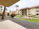 View of a beautiful courtyard with walkways, tropical foliage, flowers and benches at 10330 W Thunderbird Blvd # B101, Sun City, AZ 85351