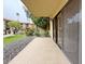 View from patio showing lawn, walkway, and condo building with tiled roof at 10330 W Thunderbird Blvd # B101, Sun City, AZ 85351