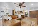 Spacious living room featuring hardwood floors, ceiling fan, and modern decor at 10406 E Silvertree Dr, Sun Lakes, AZ 85248