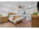 Spacious main bedroom with a ceiling fan and sliding glass doors to the back patio at 10406 E Silvertree Dr, Sun Lakes, AZ 85248