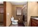 Bathroom with a shower, toilet, and vanity with granite countertop at 10718 W Saratoga Cir, Sun City, AZ 85351