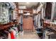 Walk-in closet featuring custom shelving, drawers, and ample hanging space for organized storage at 10718 W Saratoga Cir, Sun City, AZ 85351