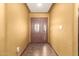 Inviting foyer with tile flooring and a decorative front door and side panel at 10718 W Saratoga Cir, Sun City, AZ 85351