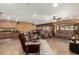 Inviting living space with an open layout, showcasing a blend of kitchen, dining, and living room furniture at 10718 W Saratoga Cir, Sun City, AZ 85351