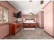 Cozy main bedroom with a rustic wood bed frame, wooden dresser, and a ceiling fan at 10718 W Saratoga Cir, Sun City, AZ 85351