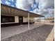 Large covered back patio with concrete flooring, offering ample space for outdoor living and entertaining at 10997 N Hualapai Dr, Casa Grande, AZ 85122