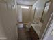 Functional bathroom featuring a single sink vanity, tiled floors, bathtub, and commode at 10997 N Hualapai Dr, Casa Grande, AZ 85122