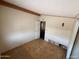 Bedroom featuring bare plywood subfloor, access door, and basic wall and ceiling finishes at 10997 N Hualapai Dr, Casa Grande, AZ 85122