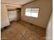 Bedroom displaying plywood flooring, a window for natural light, and essential wall finishes at 10997 N Hualapai Dr, Casa Grande, AZ 85122