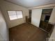 View of a bedroom featuring a window and a closet with sliding doors at 10997 N Hualapai Dr, Casa Grande, AZ 85122