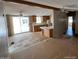 Open-concept layout with kitchen, living, and dining areas featuring tile floors at 10997 N Hualapai Dr, Casa Grande, AZ 85122