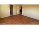 Living room featuring light walls and wood-look floors, providing a cozy and inviting atmosphere at 10997 N Hualapai Dr, Casa Grande, AZ 85122