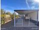 Covered patio provides an excellent outdoor living space, complemented by desert-friendly landscaping at 10997 N Hualapai Dr, Casa Grande, AZ 85122