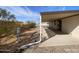 Side view of a covered patio extending along a home's exterior, offering shade and outdoor living space at 10997 N Hualapai Dr, Casa Grande, AZ 85122