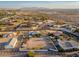 Sprawling aerial view of home with large lot, various outbuildings, and scenic desert surroundings at 11138 W Hatcher Rd, Sun City, AZ 85351