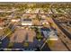 Aerial view of residential area showcasing home with large lot, outbuildings, and surrounding neighborhood at 11138 W Hatcher Rd, Sun City, AZ 85351