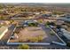 Expansive property featuring a large lot, multiple structures, and mountain views at 11138 W Hatcher Rd, Sun City, AZ 85351