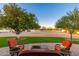 Inviting backyard patio with comfortable seating and lush green grass, perfect for outdoor relaxation at 11138 W Hatcher Rd, Sun City, AZ 85351