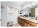 Charming bathroom features a double vanity and ample natural light from the window at 11138 W Hatcher Rd, Sun City, AZ 85351