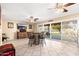 Bright open dining area featuring patio access and neutral walls at 11138 W Hatcher Rd, Sun City, AZ 85351